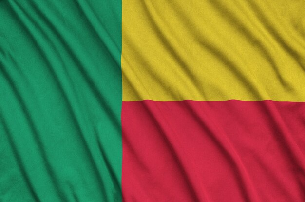 Benin flag with many folds. 