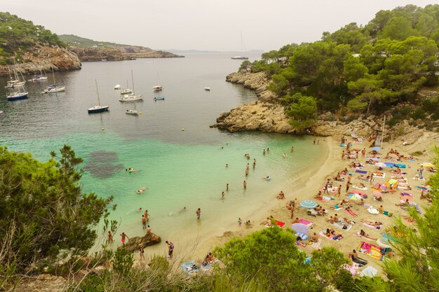 Benirras beach, Ibiza, Spain - 27 August, 2017: beautiful beach in Ibiza, Spain with a lot of tourists enjoying themselves