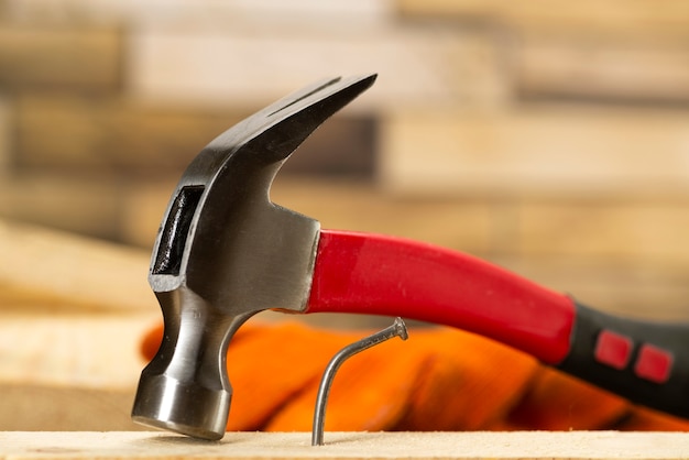 The bent nail sits on a hammer