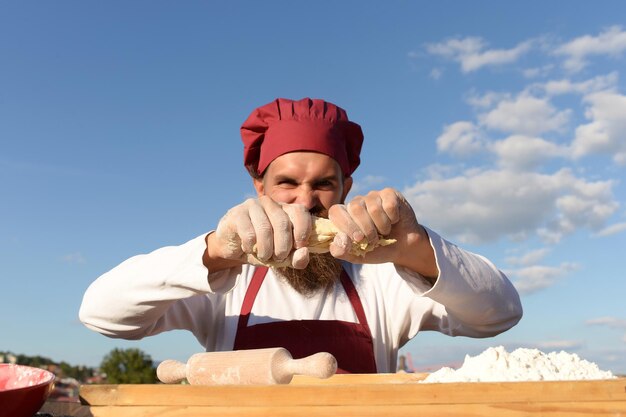 Berded man chef cooking outdoor