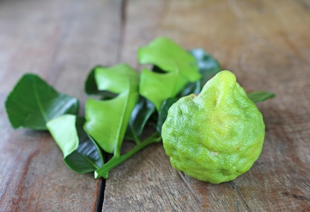 Bergamot fruit with leaf on wood table