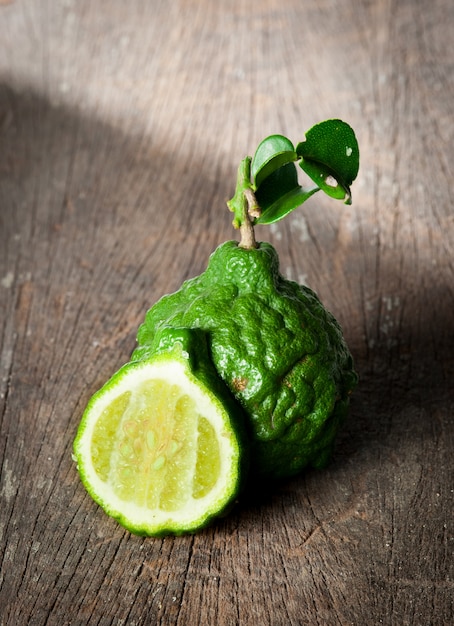 Bergamot fruit with leaf on wood