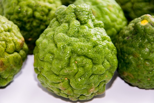 Bergamot on the white background. Citrus bergamia, the bergamot orange is a fragrant citrus with a yellow or green color similar to a lime.