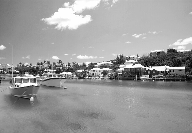 Bermuda British Overseas Territory November 26 2008 tropical bay or harbor beach of turquoise sea with modern yachts marine boats vessels at moorage on sunny day on blue sky