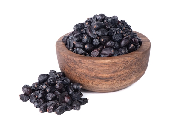 Berries of black barberry isolated on white background Spice barberry blue Dry berries of barberri