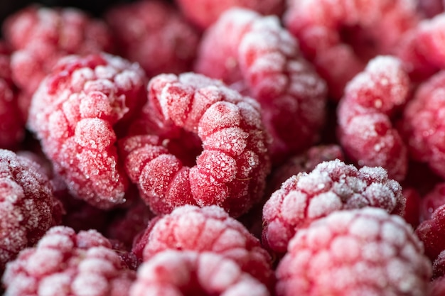 Berries of frozen raspberry background.