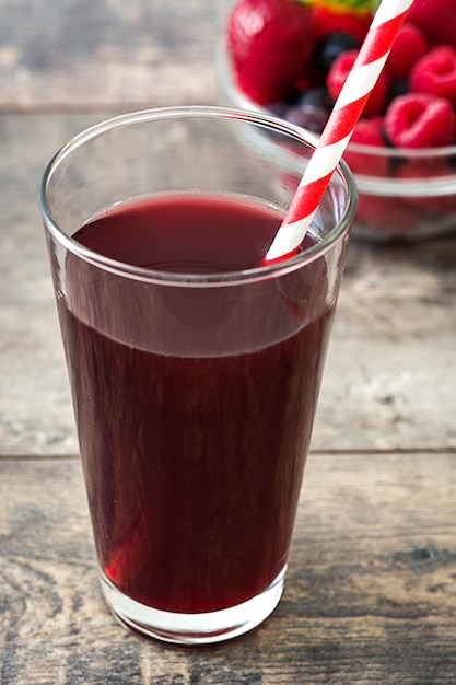 Berries smoothie on wooden table