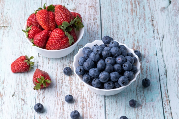 Berries, summer fruits on a wooden table