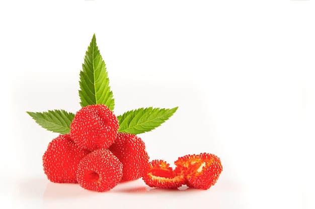 Photo berries tibetan raspberry, with leaves on white background isolated.