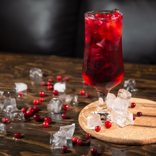 berry bright red cocktail in a large transparent glass