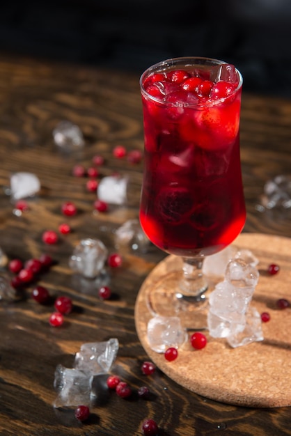 berry bright red cocktail in a large transparent glass