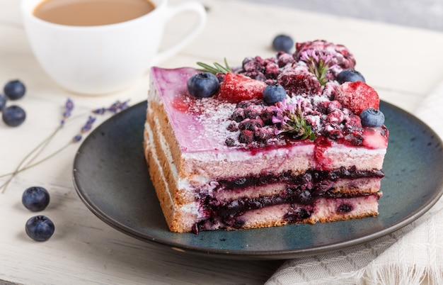 Berry cake with milk cream and blueberry jam