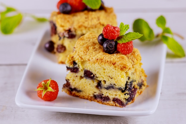 Berry coffee cake on white surface