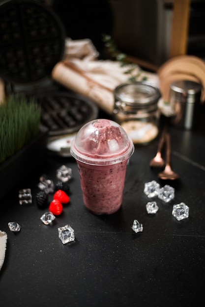 Berry smoothie served on black table at cafeÃ¢ÂÂ