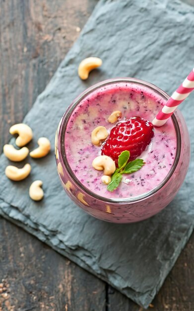 Berry smoothie with strawberries and cashew nuts