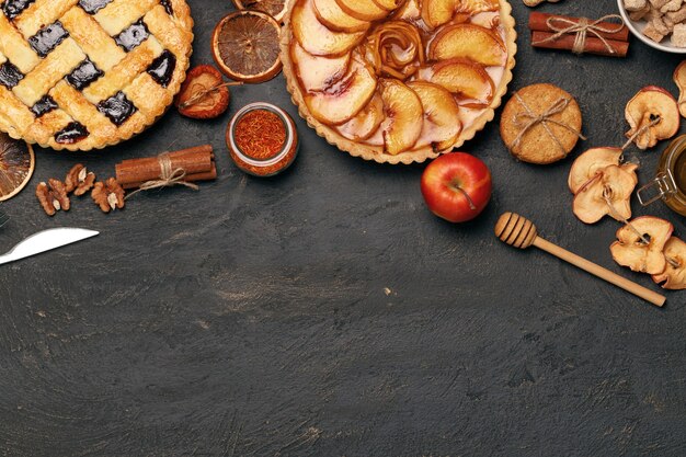 Berry tart pie and apple tart pie on black background