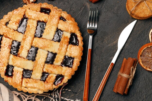 Berry tart pie on black table close up