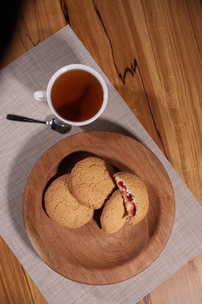 berry tea and a decorative wooden plate is very beautiful for vegetables and cookies