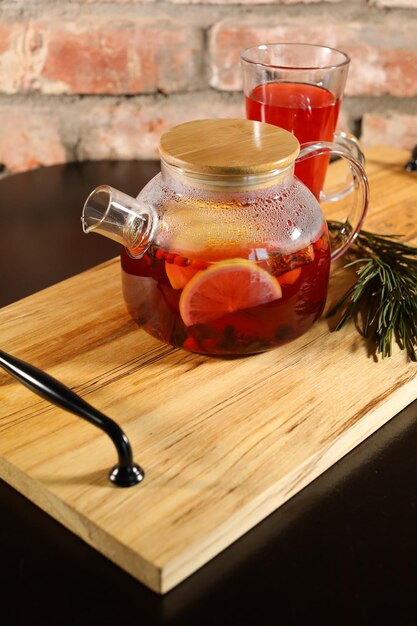 berry tea and a decorative wooden plate is very beautiful for vegetables and cookies