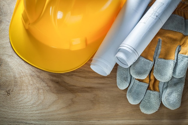 Beschermende handschoenen bouwhelm bouwplannen