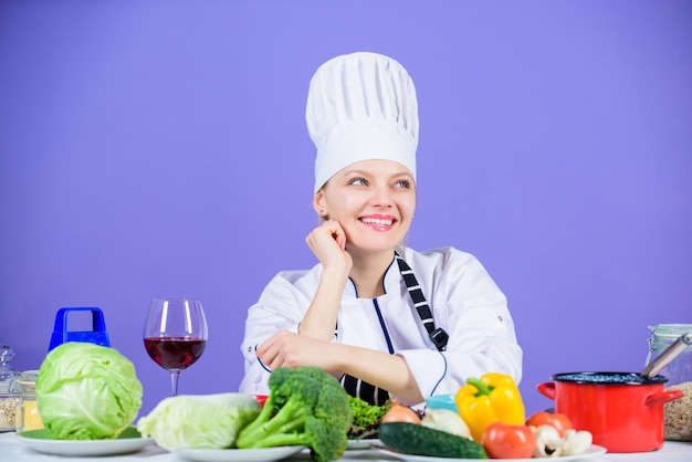 Best culinary recipes to try at home. Homemade food tips. Turn ingredients into delicious meal. Culinary skills. Woman chef wear hat apron near table ingredients. Girl adorable chef teach culinary.