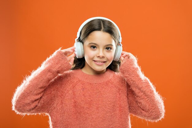 Best free music apps for your mobile device enjoy sound girl
cute little child wear headphones listen music kid listen music
orange background recommended music based on initial interest