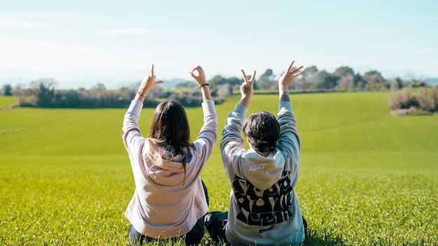 Photo best friends in the field with the word love, beautiful friendship.