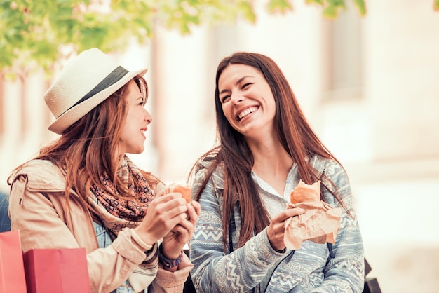 Best friends relaxing after shopping