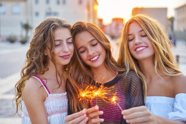 Best friends teen girls with sparklers