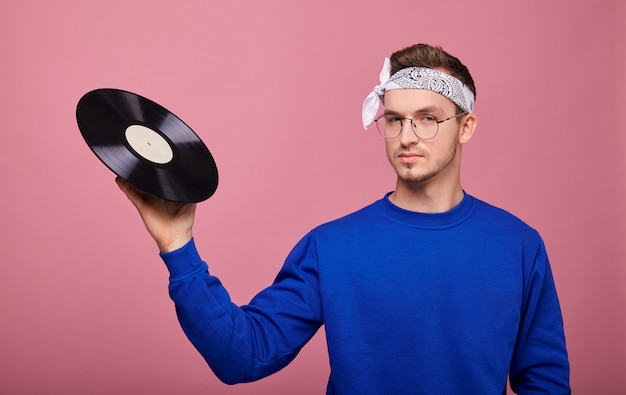 Best guy in white bandanand glasses on pink with vinyl record in hand