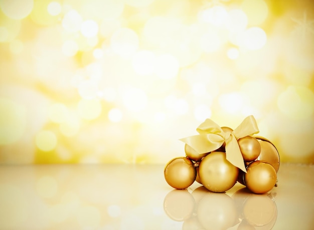 The best time of the year Studio shot of Christmas ornaments against a gold background