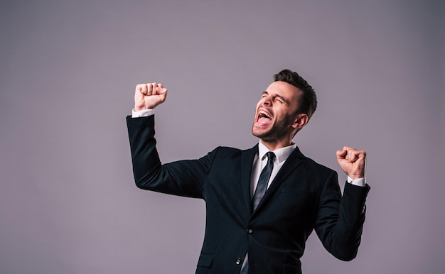 Best work! Close up portrait of excited, successful and handsome business man