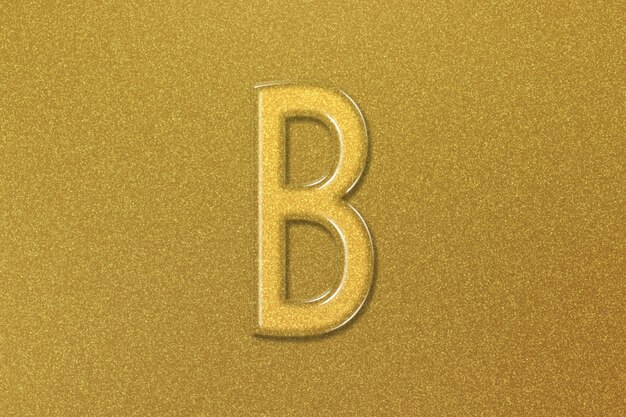 Photo beta sign beta letter greek alphabet symbol gold background