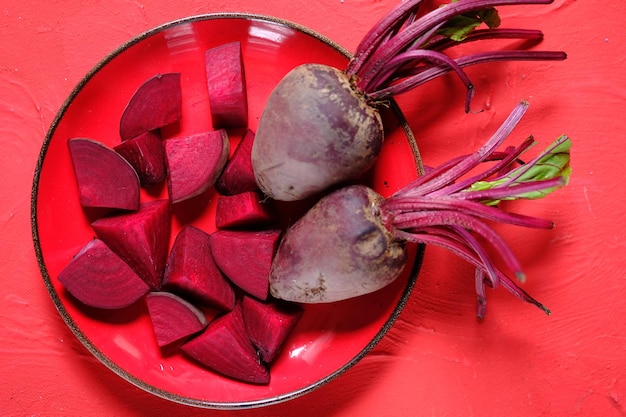 Beta vulgaris. sliced beetroot on a red plate. golden beet or red beet. red vegetables. buah bit