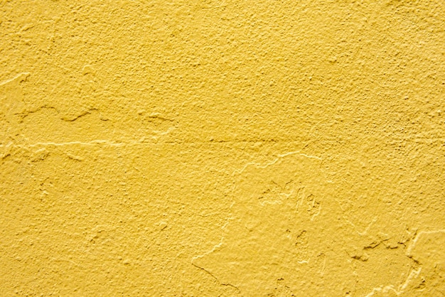 Betonnen muur schilderde keer op keer de laatste gele vectorverftextuurachtergrond