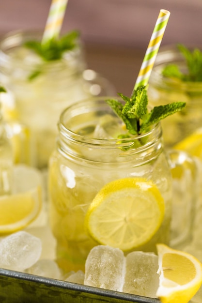 Beverage tray with with iced tea with citrus.