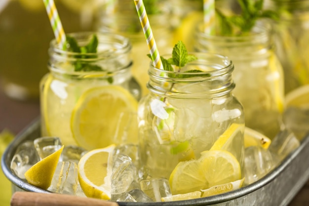 Beverage tray with with iced tea with citrus.