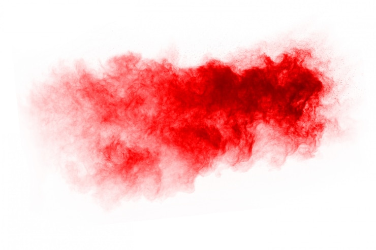 Foto bevriezen beweging van exploderend rood poeder, geïsoleerd op een witte achtergrond.