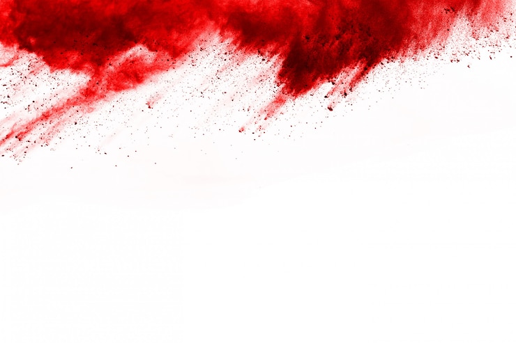 Foto bevriezen beweging van exploderend rood poeder, geïsoleerd op een witte achtergrond.