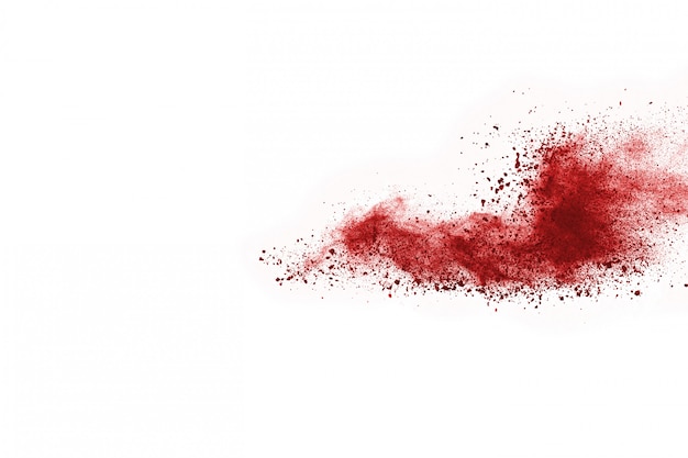 Bevriezen motie van rood poeder exploderen, geïsoleerd op een witte achtergrond.