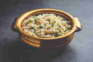 Photo bhagar indian fasting or upwas food recipe made using barnyad millet rice grains or sanwa samwa