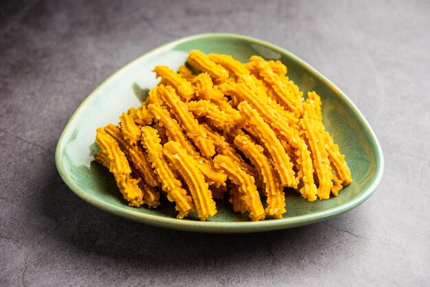 Bhajni chakli sticks or crunchy murukku snack made using diwali festival favourite munching food