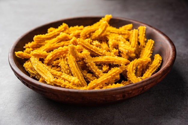 Bhajni chakli sticks or crunchy murukku snack made using diwali festival favourite munching food