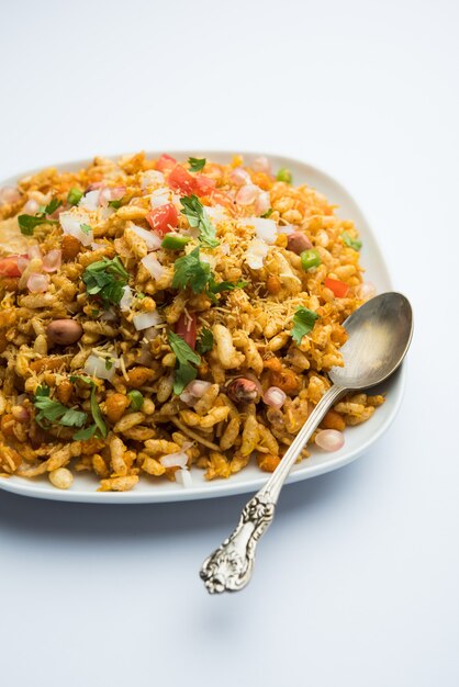 Bhelpuri Chaat or chat is a road side tasty food from India, served in a bowl or plate. selective focus