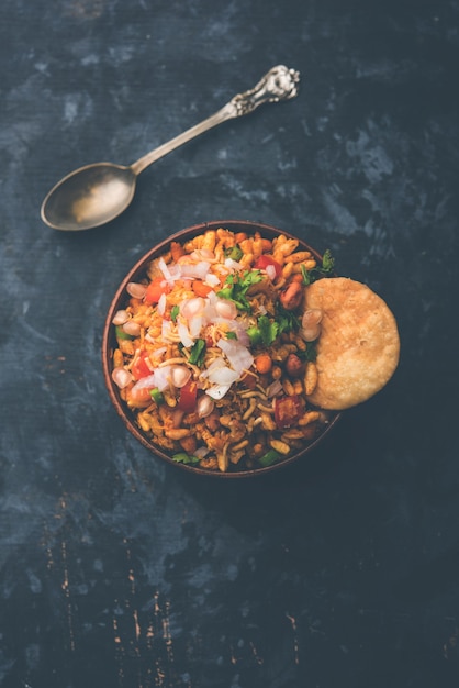 Bhelpuri Chaat or chat is a road side tasty food from India, served in a bowl or plate. selective focus