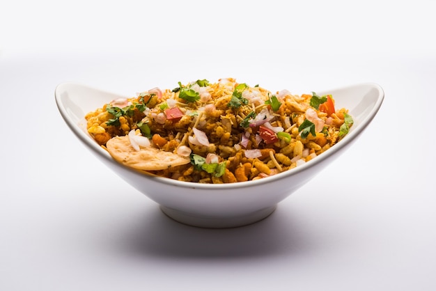 Bhelpuri Chaat or chat is a road side tasty food from India, served in a bowl or plate. selective focus