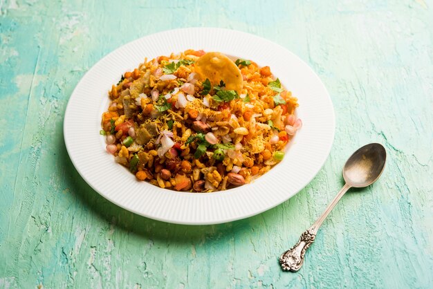 Bhelpuri Chaat or chat is a road side tasty food from India, served in a bowl or plate. selective focus