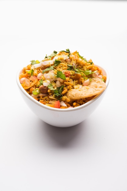 Bhelpuri Chaat or chat is a road side tasty food from India, served in a bowl or plate. selective focus