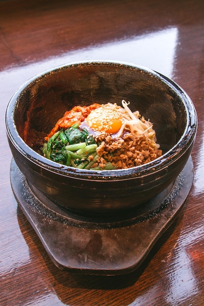 Bibimbap in a heated stone bowl Korean food