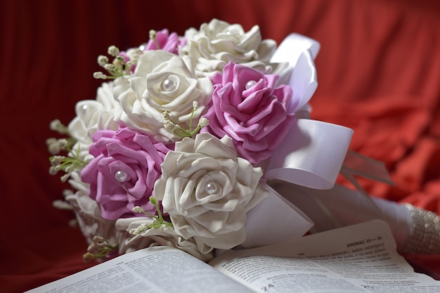 bible and bouquet of flowers